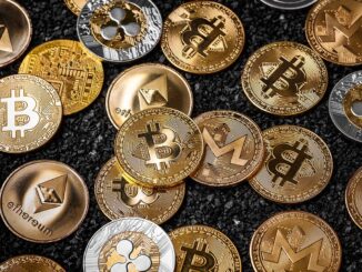 Picture of different crypto coins laying on top each other