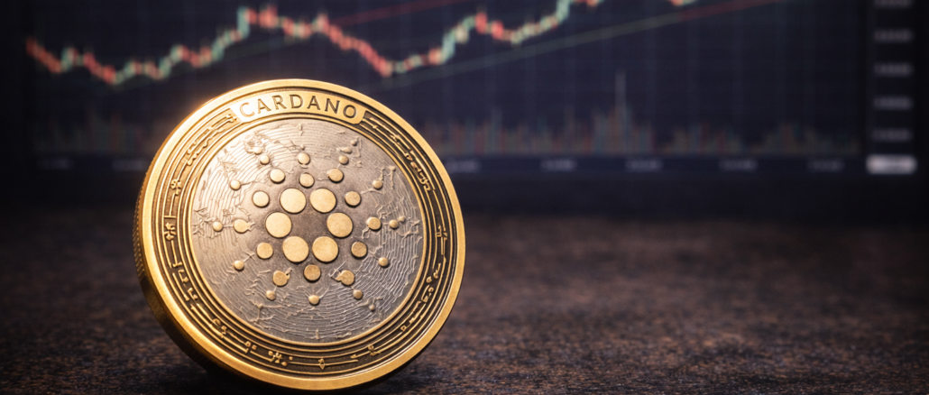 A Cardano (ADA) cryptocurrency token placed on a table with a blurred upward-trending market chart in the background.